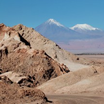 View to the Volcanoes Licancabur and Juriques from a vantage point in the Valle de la Luna